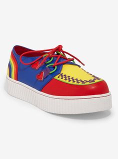 Always be bright and have Pride! Constructed from a variety of hues  this shoe is designed using vegan leather and adorned with vibrant red laces and heart D-ring holders. The rainbow back piece adds a unique touch while the white rubber outsole provides durability.Listed in women's sizes.1'' platformPolyurethane upper; rubber soleImported Cool Platform Shoes, Rainbow Masc Outfits, Rainbowcore Clothes, Kidcore Shoes, Clowncore Shoes, Cute Clown Shoes, Silly Shoes, Kidcore Accessories, Indie Shoes