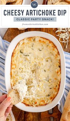 cheesy artichoke dip in a white bowl on a wooden cutting board