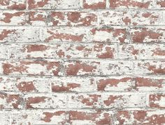 an old brick wall with white and red paint