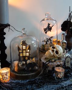 a table topped with lots of halloween decorations and decor on top of eachother