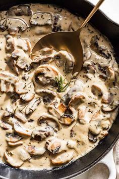 a skillet filled with mushrooms and gravy