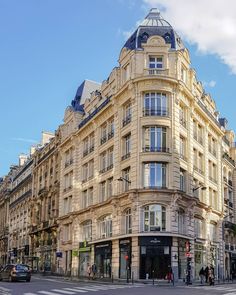 an old building on the corner of a street