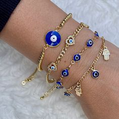 Cute and tiny evil eye bracelets. Details: Material: Gold Filled 18k Length: 6.5 in. plus 1 inch extender *All items are nicely packed ready to gift. *It's best to keep it away from chemical products and keep away from water, lotion, and perfum. Visit my shop: https://www.etsy.com/shop/AguaDoradaDesign Follow me on instagram: https://instagram.com/aguadoradadesign?igshid=YmMyMTA2M2Y= Evil Eye Jewelry Bracelet, Blue Evil Eye Bracelet, Hand Protection, Turkish Eye, Eye Gift, Greek Evil Eye, Jewelry Fashion Trends, Classy Jewelry, Blue Evil Eye