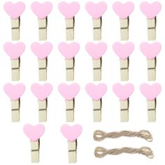 pink heart shaped wooden clothes pins with string attached to the ends and two strings on each side