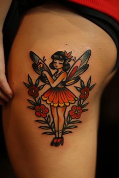 a woman with a tattoo on her thigh