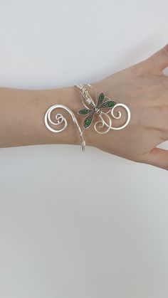 This is handmade dragonfly cuff bracelet  made from silver plated metal with emerald swarovski crystals intricately woven together to create this lovely elven inspired cuff perfect to wear every day or to special events and weddings Check my other items to see the matching necklace and matching circlet It is also available in Gold. The cuff is adjustable and will fit most sizes, If you are still concerned it wont fit then just give me your exact measurements and I can make it in your size :) Dragonfly Bracelet, Emerald Crystal, Peridot Crystal, Dragon Fly, Wedding Sandals, Crystal Wedding, Matching Necklaces, Bracelet Silver, Silver Cuff