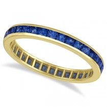 a yellow gold band with blue sapphire stones