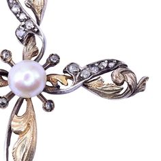 This is part of Chairish’s Fine Jewelry assortment.  Antique Art Nouveau foliate pearl & diamond cross pendant, circa 1915. This antique cross pendant is crafted in 18 karat gold and silver in a foliate design. The Art Nouveau cross features 27 rose cut diamonds and a 5.85mm pearl center.  Dimensions 2.625"H x 1.5"W Heart Necklace Tiffany, 20th Century Art, Peridot Necklace, Gold Cross Necklace, Garnet Necklace, Gold Charm Necklace, Diamond Cross Pendants, Diamond Cross, Silver Heart Necklace