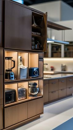 a kitchen with wooden cabinets and appliances on display