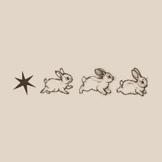 three rabbits sitting next to each other in the middle of a star, with one rabbit running