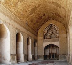 the inside of an ornate building with arches and doorways