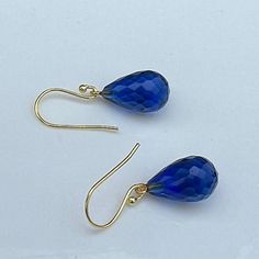 This listing is for: Gold  925 sterling Silver Royal Blue sapphire quartz drop Earrings, Royal blue sapphire quartz Drop Earrings, Jewelry Gift For Her.   Blue sapphire quartz drop shaped Drops are attached to 925 Sterling Silver Gold  Gemstone : Blue sapphire quartz  Gemstone Size : Approx. 15X10 mm type of gemstone :  Blue sapphire quartz    Material : 925 Sterling Silver, Gold Plated Check out the other sparkly color options for more fun: https://www.etsy.com/shop/BeautyOfImagination?ref=shop Blue Briolette Teardrop Earrings For Gift, Blue Faceted Drop Earrings, Sapphire Briolette Gemstone Earrings, Sapphire Teardrop Gemstone Earrings, Sapphire Teardrop Earrings For Gift, Blue Drop Earrings With Ethical Gemstones, Hypoallergenic Blue Briolette Earrings, Blue Faceted Drop Jewelry, Blue Briolette Gemstone Earrings