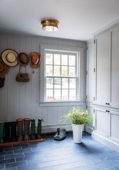 a room with several hats on the wall