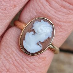 Stunning Vintage 1950's English hallmarked solid 9ct gold shell cameo ring in a size P. Detail. Solid 9ct gold. Peach coloured bullouth shell cameo. Lovely quality hand carved profile of a Roman lady. Minimal rub over bezel setting. Comfortable rounded cross section. Hallmarked 9ct to the inside of the band. Condition. Vintage worn before. Well looked after and nice and clean. There is a little movement in the cameo but it is still secure. It has been polished and is ready to wear. Please see al Vintage Gold Cameo Ring, Signet Rings, Cameo Ring, Vintage Wear, Signet Ring, Bezel Setting, Vintage 1950s, Favorite Jewelry, Solid Gold