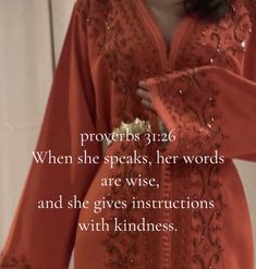 a woman in an orange dress with the words provers 31 26 when she speaks, her words are wise and she gives instructions with kindness