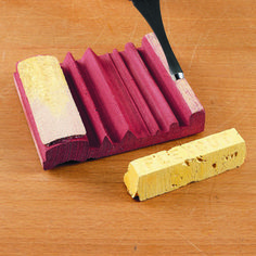 a wooden table with a pencil and eraser next to it on top of wood