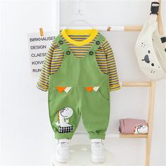 Boys Stripe Cute Dino Cartoon Top & Jumpsuit - PrettyKid Green Cotton Sets With Cartoon Print, Playful Cotton Long Sleeve Jumpsuits And Rompers, Playful Long Sleeve Jumpsuits And Rompers For Playwear, Playful Long Sleeve Jumpsuits And Rompers For Playtime, Green Long Sleeve Onesie For Spring, Green Cartoon Print Sets For Spring, Long Sleeve Green Onesie For Playwear, Green Long Sleeve Onesie For Playwear, Cotton Long Sleeve Jumpsuits And Rompers With Cartoon Print