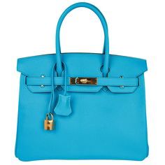 Mightychic offers an Hermes Birkin 30 bag featured in coveted Blue Aztec. This stunning rare colour is considered to be among the most gorgeous of all Hermes Blue hues. Chevre leather accentuates the beauty of Hermes colours. Lush with gold hardware. Plastic still on hardware. This Hermes Birkin bag is divine colour for year round wear. Comes with the lock and keys in the clochette and sleepers. Private and discrete consignment services offered. final sale Private and discrete consignment servic Luxury Blue Shoulder Bag For Daily Use, Luxury Blue Shoulder Bag, Luxury Blue Top Handle Bag, Luxury Blue Bag With Detachable Strap, Luxury Blue Bags With Detachable Strap, Luxury Blue Bag For Everyday Use, Luxury Blue Top Handle Satchel, Luxury Blue Shoulder Bag For Shopping, Luxury Blue Satchel With Palladium Hardware