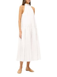 "Find STAUD Marlowe Poplin Halter Maxi Dress on Editorialist. Fashioned from cotton poplin, Staud's Marlowe maxi dress features a halter neck, drop waist, and single-tiered skirt. This sleeveless piece is finished with a cut-out back and self-tie bow closure. Halterneck Sleeveless Drop waist Back self-tie closure 98% cotton/2% spandex Dry clean Imported SIZE & FIT Model measurements: 5'10\" tall Model is wearing a US size Small. Staud. Color: White. Size: XS." Ladies Day Dresses, Tiered Maxi Skirt, Halter Maxi Dress, Halter Midi Dress, Trapeze Dress, Halter Maxi, Navy Midi Dress, Linen Maxi Dress, Tie Bow