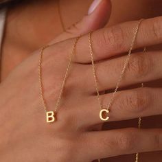 Description: Discover the elegance and versatility of our Stainless Steel Initial Necklace for Women. This exquisite choker features gold-colored cut-out letters, allowing you to personalize it with a single name, making it a unique and meaningful accessory. Perfect as a jewelry gift, this necklace is ideal for any special occasion or to add a personal touch to your daily style. Made from high-quality stainless steel, it ensures durability and resistance to wear, maintaining its shine and beauty over time. Features: Material: High-quality stainless steel Color: Gold Personalization: Initial or full name Design: Precisely cut-out letters Chain Length: Adjustable for a comfortable fit Ideal for: Gifts, special occasions, daily wear Care Instructions: To maintain the shine and beauty of your Initial Necklace Aesthetic, Letter Necklace Gold, Name Choker, Necklace Aesthetic, Golden Jewelry, Initial Necklace Gold, Trendy Necklaces, Gold Initial, Letter Necklace