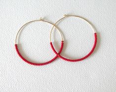 These hoops are dainty and carry high quality red seed beads. Also available with other metals (choose preference at checkout) ❤ SIZES They measure 45 mm in diameter. ❤ PROCESSING AND SHIPPING Most orders are made and shipped out in one business day. Please check delivery timeframes for your location on the description below. ❤ CUSTOM ORDERS Contact me to discuss you needs! Go back to my shop: https://www.etsy.com/shop/StephanieMartinCo See more fabulous earrings here: https://www.etsy.com/shop/ Red Small Hoop Earrings, Handmade Red Hoop Earrings For Everyday, Red Handmade Hoop Earrings For Everyday, Small Red Hoop Earrings For Everyday Wear, Red Small Hoop Earrings For Everyday, Nickel Free Red Hoop Earrings, Red Hoop Jewelry For Everyday, Nickel-free Red Hoop Earrings, Everyday Red Hoop Jewelry