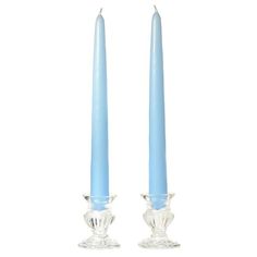 two blue candles sitting next to each other