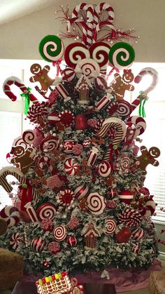 a christmas tree decorated with candy canes and candies