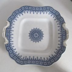 a blue and white plate sitting on top of a table