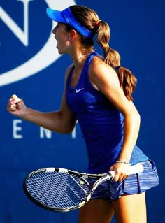 a female tennis player in action on the court