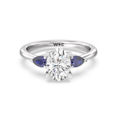 a diamond and blue sapphire engagement ring