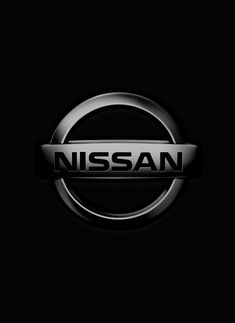 the nissan logo is shown in black and silver, against a dark background that appears to be lit from below