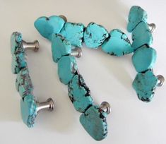 I have been a designer for many years and all of my drawer pulls are made by me. All are one of a kind. I design all of my handles when ordered and are not mass produced. They average 4 inches across. The hole to hole is 3 inches. Screws included. Turquoise Cabinets, Turquoise Kitchen, Kitchen Knobs, White Drawers, Drawer Hardware, Southwest Style, Drawer Pull Handles, Rose Quartz Gemstone, Rocks And Gems