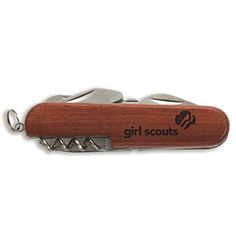 a bottle opener with a wooden handle and two metal blades on the top of it