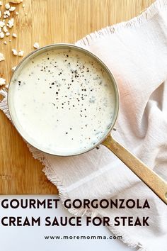 gourmet gorgonzolla cream sauce for steak on a wooden cutting board