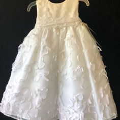 Two Flower Girl Dresses, White From David’s Bridal, Size 2t, New With Tags 23 Inches Long Absolutely Beautiful With Lots Of Ruffles Underneath Gorgeous Ribbon Work All Over Them, You Can See It In The Photograph Zip Back With A Bow In The Back. Absolutely Gorgeous, Use For Wedding Or Just Dress Up, $25 Each White Twirl Dress For Spring, White First Communion Dress For Spring Ceremony, Spring First Communion Dress, Cute White Pageant Dress, Fitted First Communion Dress For Spring, Floral Applique Dress For First Communion In Spring, White Twirl Dress For Dress-up, White Fitted Twirl Dress For Dress-up, White Ruffled First Communion Dress For Spring