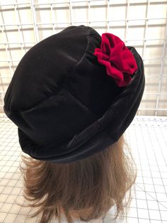 I made this beautiful velvet hat out of a rich black velvet and lined it with a matching color fleece for warmth and body. It's sized to fit most adults 22-23 inches around head. The brim can be worn up or down as it has velvet on both sides. It's a very comfortable fit on my 22 1/2 inch head. Dry clean only. I added a handmade burgundy velvet rose for a pretty look. A great hat for any season. And yes, there are that many pieces for this hat that have to be cut, ironed and sewn together! Velvet Rose, Velvet Hat, Burgundy Velvet, Upcycled Fashion, Winter Hats For Women, Brim Hat, Black Velvet, How To Look Pretty, Color Matching