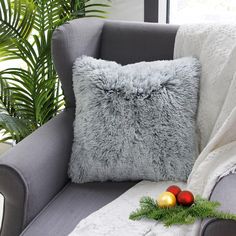 a grey couch with christmas decorations on it