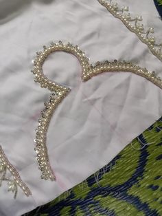 a piece of cloth with beading on it