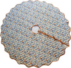 a blue and white placemat with a gold trim