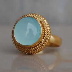 Round Cab Aqua Chalcedony 925 Sterling Silver Ring, Round Aqua Chalcedony Gemstone 18K Rose Gold, 18K Yellow Gold Ring, Statement jewelry Gemstone : Chalcedony Stone Size : 10 mm Ring Size : Please Choose Your Size stone Color : Aqua Material : Please choose your metal It's a unique gift for anyone zodiac style ring . Please Notice before checkout :- Due to we use natural stones, the stones may vary slightly in shape, size and color. Contact us for any other gemstone customization before checkou Gold Chalcedony Jewelry For Anniversary, Yellow Gold Chalcedony Ring Gift, Handmade Gold Chalcedony Rings, Yellow Gold Amethyst Ring, Gold Amethyst Ring, Chalcedony Stone, Color Aqua, Aqua Chalcedony, Zodiac Jewelry