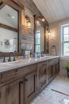 a large bathroom with two sinks, mirrors and wood paneled walls in the background