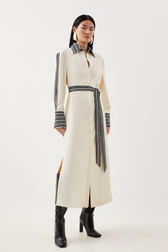 Balanced Proportions Are Spotlighted By This Midi Dress, Flowing Over The Silhouette With A Lightweight Twill Construction. Characterised By Striped Borders To The Long Batwing Sleeves, Self-Tie Belt, And Collared V-Neck Bodice, This Piece Pairs Best With Streamlined Stilettos For A Truly Polished Effect.Collared V-Neckbatwing Sleevesmidi Lengthself-Tie Belt Grey Shirt Dress Outfit, Business Formal Dresses, Cloth Belts, Midi Long Sleeve Dress, Cutwork Dress, Wardrobe Minimalist, Striped Casual Dresses, Tie Sleeve Dress, Sophisticated Fashion