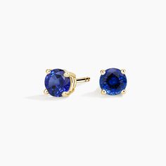 Solitaire Sapphire Stud Ears - 18K Yellow Gold. A beautifully matched pair of brilliant blue sapphires are secured in classic four-prong basket settings with comfortable push back posts for pierced ears. Classic Round Tanzanite Earrings, Classic Blue Brilliant Cut Earrings, Brilliant Round Cut Sapphire Earrings, 14k Yellow Gold Solitaire Earrings, Classic Yellow Gold Jewelry With Lab-created Sapphire, Classic Yellow Gold Lab-created Sapphire Jewelry, Luxury Sapphire Yellow Gold Earrings, Fine Jewelry Sapphire Round Cut Earrings, Formal Yellow Gold Sapphire Earrings