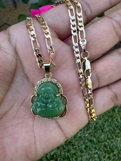 This gold-plated Buddha pendant necklace will add a touch of serenity and spirituality to your look. Showcasing a classic Buddha figure, this necklace will bring a peaceful energy to your wardrobe.Gold plated 18” Chain Buddha Pedant with Chain Tarnish free/won't turn your skin green with proper care Pendants and Chains are gold plated 5 times for a long lasting durable shine Spiritual Gold Plated Necklace For Good Luck, Spiritual Gold Necklace With Figaro Chain, Spiritual Pendant Jewelry With Figaro Chain, Spiritual Jewelry Pendant With Figaro Chain, Gold Spiritual Crystal Necklaces With Adjustable Chain, Spiritual Gold Figaro Chain Necklace, Gold Spiritual Crystal Necklace With Adjustable Chain, Gold Necklace With Figaro Chain, Spiritual Gold Plated Chain Necklace