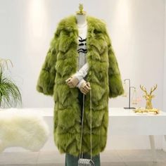 Winter Fur Coat With Feather Trim And Long Sleeves, Long Fur Coat With Feather Trim For Winter, Long Sleeve Fur Coat With Feather Trim For Winter, Fall Fur Coat With Feather Trim For Cold Weather, Winter Faux Fur Coat With Feather Trim, Green Faux Fur Coat With Faux Fur Trim, Fluffy Faux Fur Coat For Winter, Fluffy Faux Fur Winter Coat, Winter Fluffy Faux Fur Coat