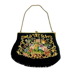 "Vintage purse handbag featuring a beautifully handmade needlepoint tapestry floral exterior. Both front and back are embellished as well as along the bottom and side edges. Based on my research my guess is that the purse dates to the 1940s. It has a brass frame with ornate glass bead embellished clasp. It has a 12\" chain handle and is lined with heavyweight ribbed fabric and has two pockets. The lining fabric is heavily soiled with dirt and some lipstick stains. (please see all photos) The lin Formal Embroidered Tapestry Bag, Handmade Tapestry Evening Bags, Handmade Tapestry Bags For Evening, Victorian Style Rectangular Tapestry Bag, Victorian Style Embroidered Rectangular Bag, Gold Clutch Purse, Tapestry Handbags, Lipstick Stain, Needlepoint Tapestry