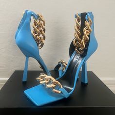 100% Authentic & Brand New! 110mm Heel, Leather Upper Back Zip Closure, Metal Chain Details. Runs Small, Size 40 , But Will Fit A 39/ 9us , Box And Dust Bag Included. Designer Heels With Chain Strap For Party, Formal High Heels With Chain Detail, Luxury High Heel Chain Detail Heels, Luxury High Heels With Chain Detail, Luxury Chain High Heels, Leather High Heels With Chain, Versace Blue, Versace Shoes, Fancy Shoes