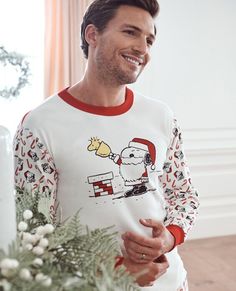 Sweet and festive adult unisex Snoopy candy cane mix-print pajama top in soft organic cotton rib knit. Made to last for holiday seasons to come! • Unique artwork only available at Hanna • Hypoallergenic & eczema-friendly • Sensory-friendly scratch-free seams that lay flat on the skin • OEKO-TEX® STANDARD 100 certified safe from hundreds of harsh chemicals 100% organic combed cotton rib knit Super-smooth flatlock seams Soft ribbed neck and cuffs Tops and pants offered separately for the very best Santa Sweater, Long Johns Pajamas, Unisex Pajamas, Adult Pajamas, Sensory Friendly, Cuffed Top, Long John, Sleepwear & Loungewear, Print Pajamas