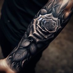 a black and white rose tattoo on the arm