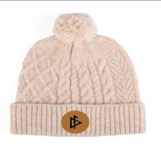 Made with soft and breathable cotton fabric, this beanie provides ultimate comfort and warmth for those chilly days. The beanie features a beautifully stitched DeemedFit logo centered on the front, adding a touch of elegance and sophistication to your outfit. Whether you're heading out for a casual day out or hitting the slopes, this beanie is the perfect addition to complete your look. Its versatile design and neutral color make it easy to pair with any outfit. Stay fashionable and comfortable. Winter Cotton Bonnet Cap, Cotton Winter Bonnet, Adjustable Cotton Hats For Winter, Adjustable Cozy Beanie Cap, Adjustable Cotton Winter Hat, Cozy Adjustable Beanie Cap, Winter Cotton Bonnet Hat, Adjustable Cotton Winter Bonnet, Winter Cotton Bonnet